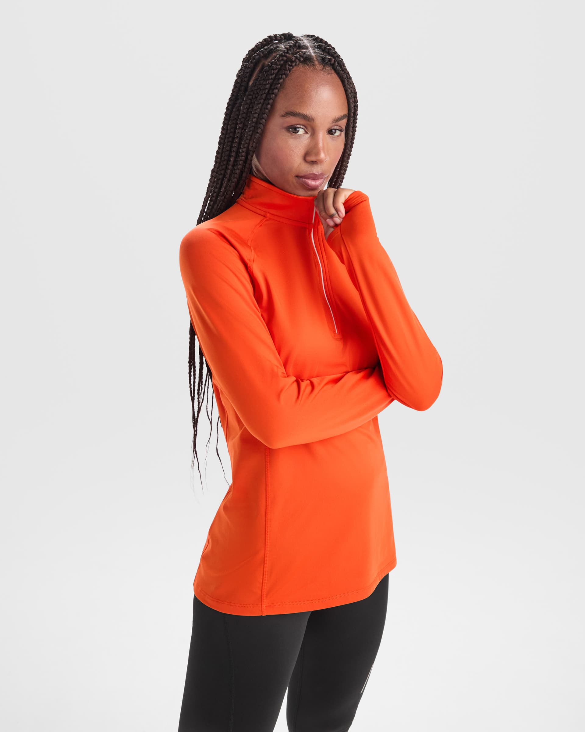 Sudadera técnica entallada para mujer con media cremallera y reflectantes